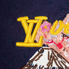 Close-up of multicolor 'V' lettering embroidery on dark navy short-sleeve T-shirt
