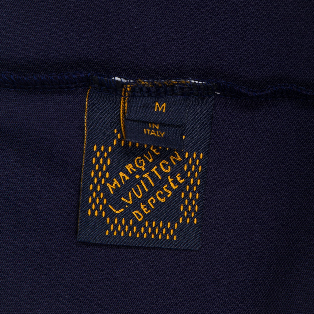 Inside neck label on dark navy T-shirt, marked Made in Italy