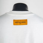 T-shirt back neck label in orange on white fabric