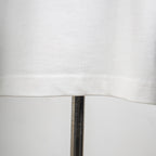 White T-shirt fabric texture and side seam stitching close-up
