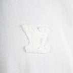 White T-shirt close-up with embroidered chest logo
