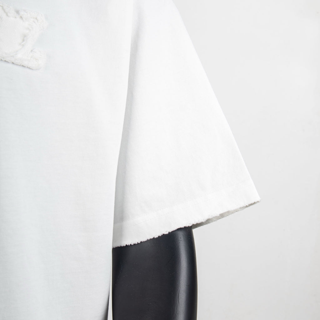 White T-shirt sleeve and side hem detail