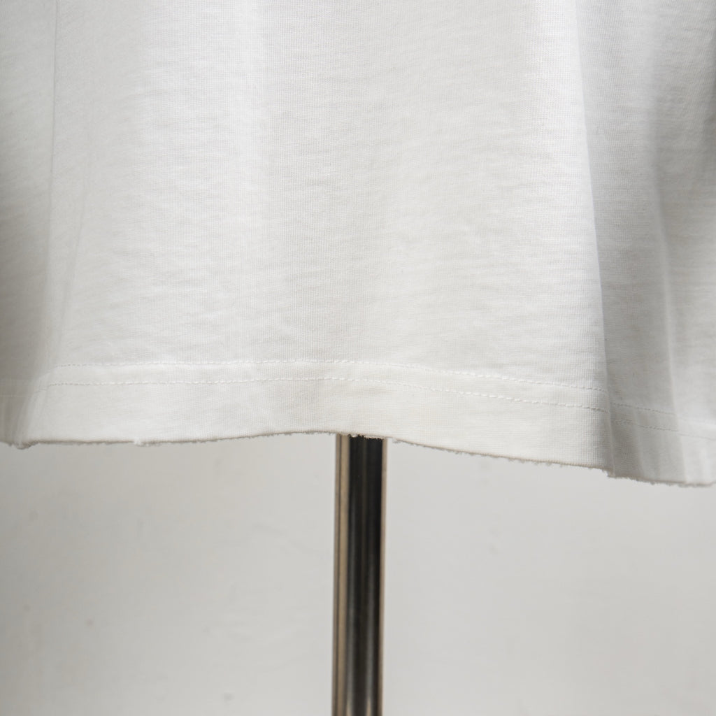 White T-shirt hem and lower seam close-up