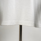 White T-shirt hem and lower seam close-up
