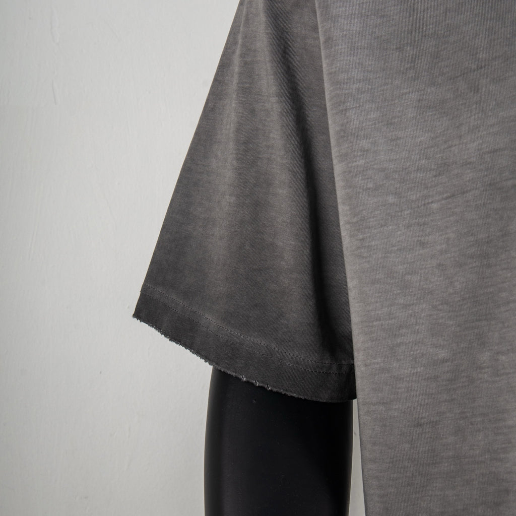 Grey short-sleeve T-shirt showing drape and side hem stitching