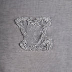 Grey T-shirt with ornate grey embroidered emblem detail
