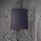 Grey T-shirt neckline with hanging Louis Vuitton logo tag