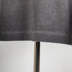 Grey T-shirt hem with visible stitch line