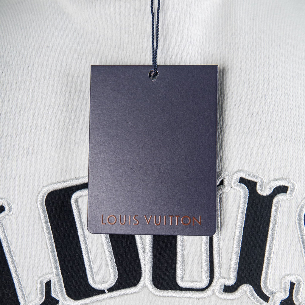 Clothing price tag hanging near a printed T-shirt design