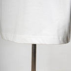 White T-shirt bottom hem stitching close-up