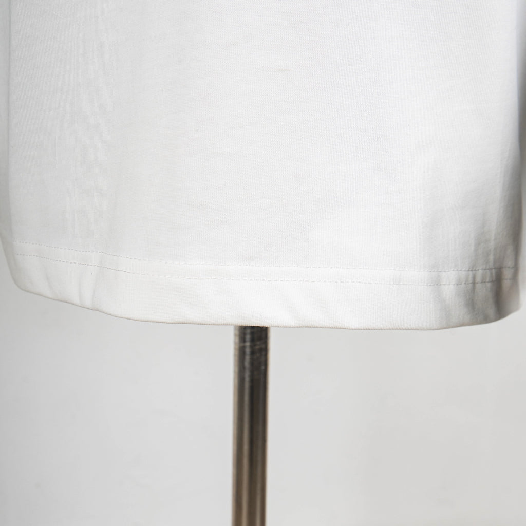 White T-shirt bottom hem with stitched edge