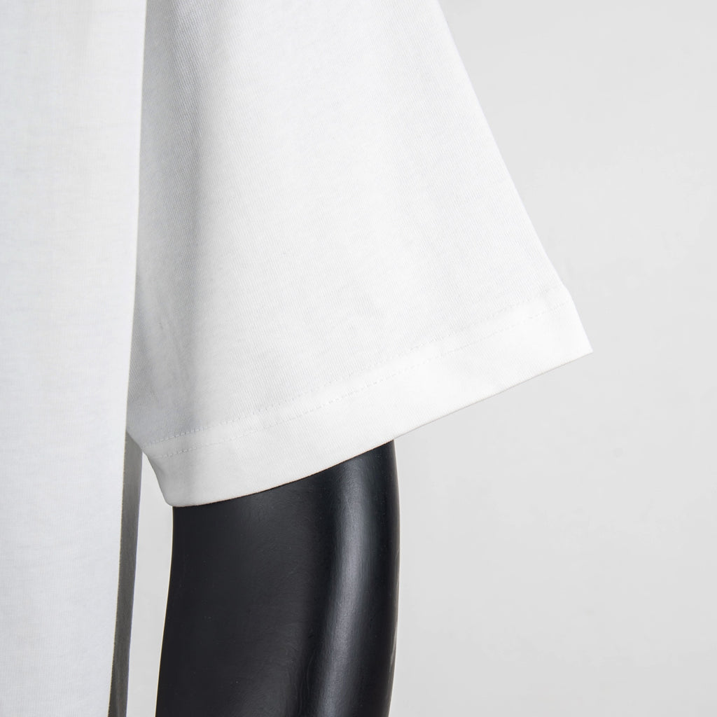 White T-shirt sleeve and side hem close-up
