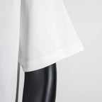 White T-shirt sleeve and side hem close-up