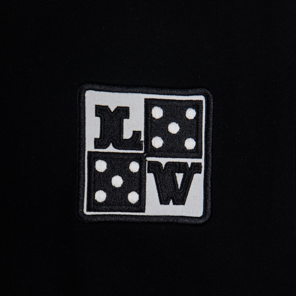 Black T-shirt with small square Louis Vuitton logo patch
