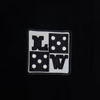 Black T-shirt with small square Louis Vuitton logo patch