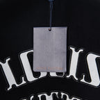 Louis Vuitton black T-shirt with large arched logo print, tag hanging over front