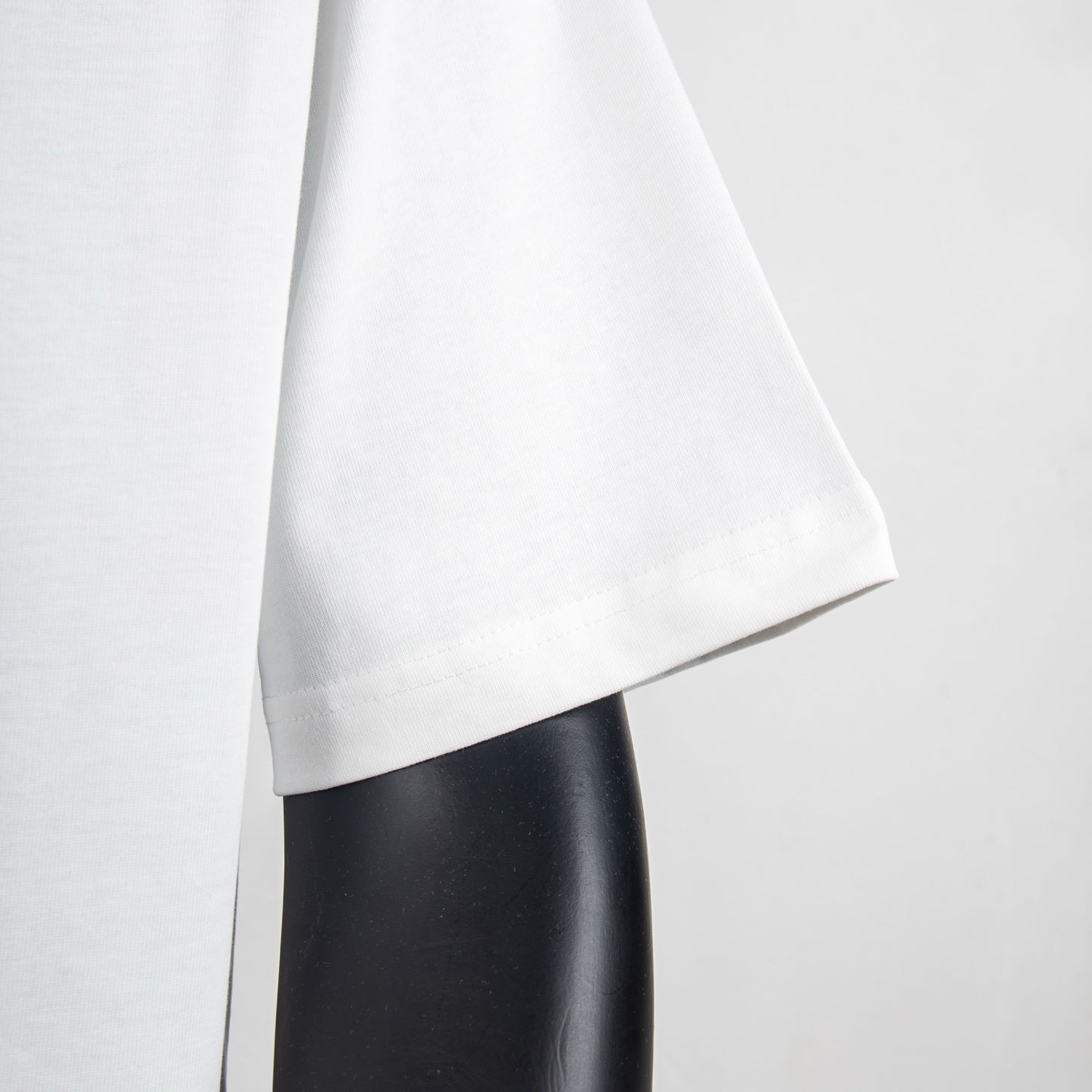 Louis Vuitton white T-shirt bottom hem detail along side
