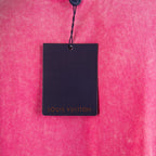 Pink T-shirt with hanging Louis Vuitton product tag