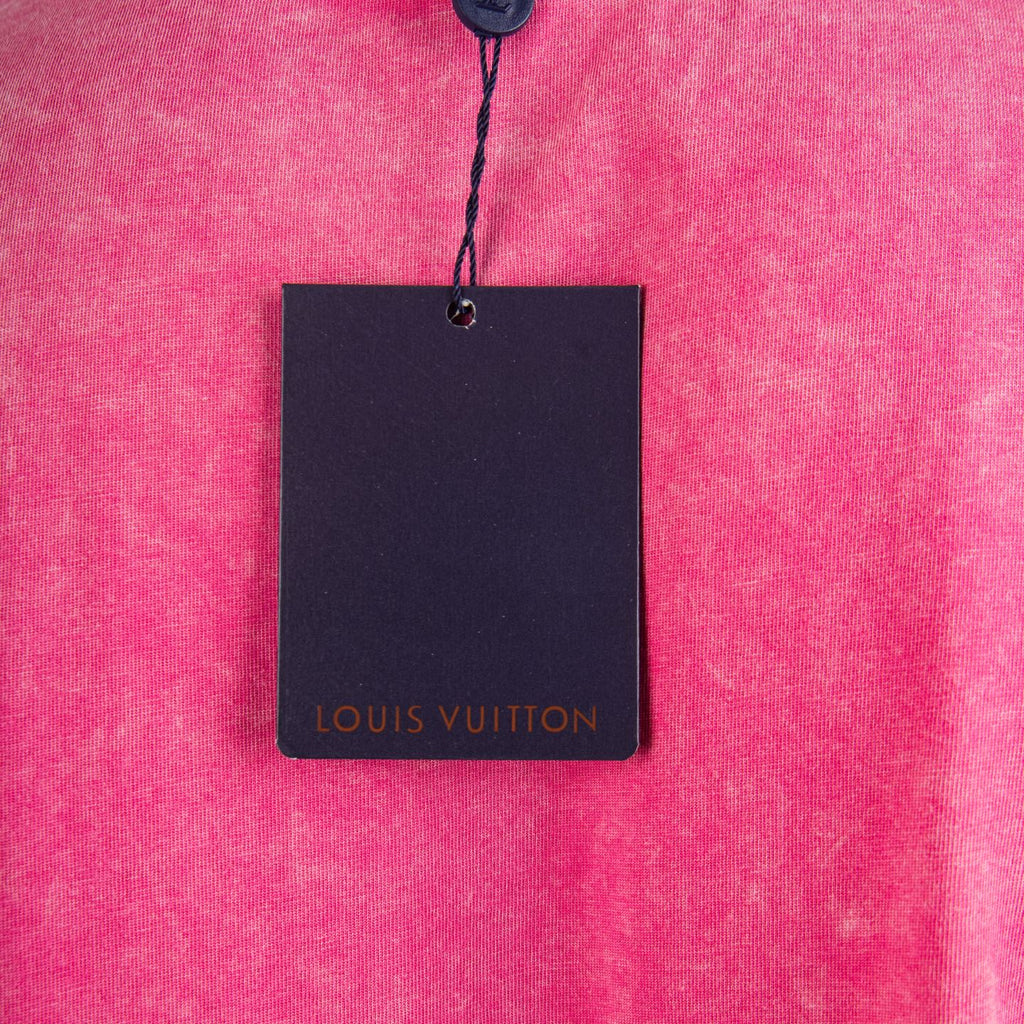 Louis Vuitton pink T-shirt with hanging black garment tag