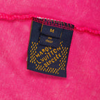 Pink T-shirt inner label showing size M and “In Italy” text