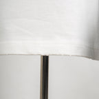 White T-shirt hem stitching and seam detail