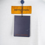 White T-shirt with hanging Louis Vuitton tag and yellow neck label