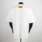 White T-shirt back view with yellow brand label at upper back