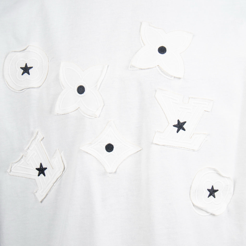 White T-shirt with embroidered star and flower patches