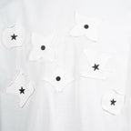 White T-shirt with embroidered star and flower patches