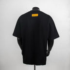 Black crewneck T-shirt back view with yellow Louis Vuitton label
