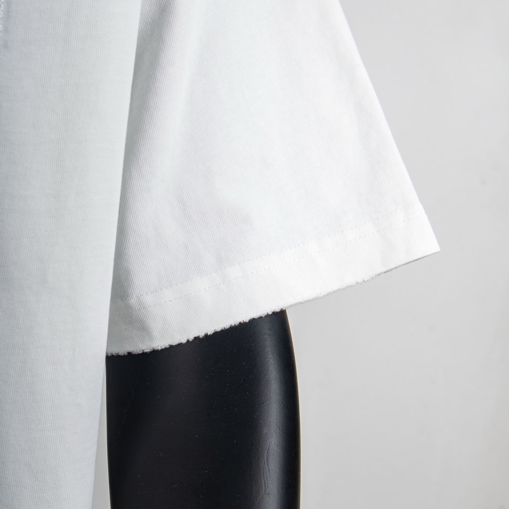 White T-shirt sleeve edge and side hem close-up
