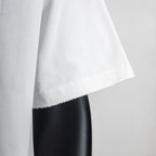 White T-shirt side view with short sleeve cuff and straight hem