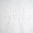 White T-shirt front with raised embossed lettering detail