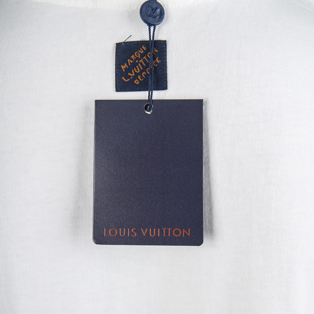 White T-shirt with hanging Louis Vuitton retail tags