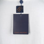 White T-shirt with hanging Louis Vuitton retail tags