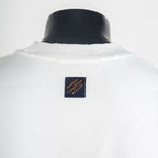 White T-shirt neckline with blue logo label