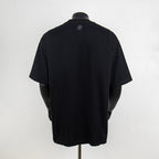 Black short-sleeve T-shirt with small logo patch at back collar