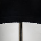 Black T-shirt hem with double-stitched finish