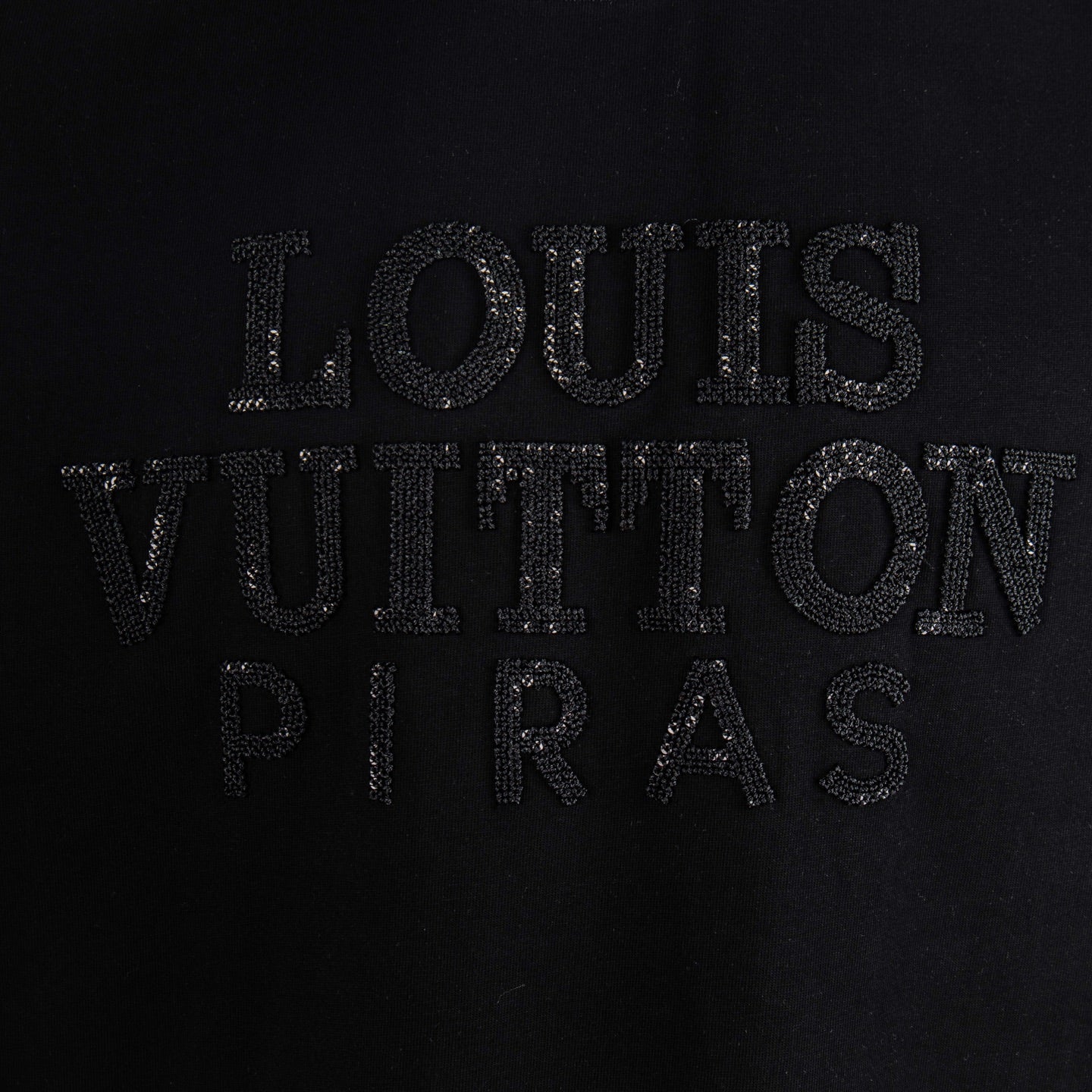 Black T-shirt with textured Louis Vuitton lettering logo detail