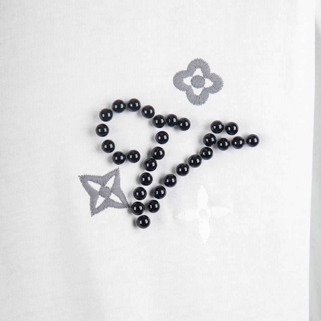 Louis Vuitton T-shirt applique detail: black bead embroidery with flower and star motifs