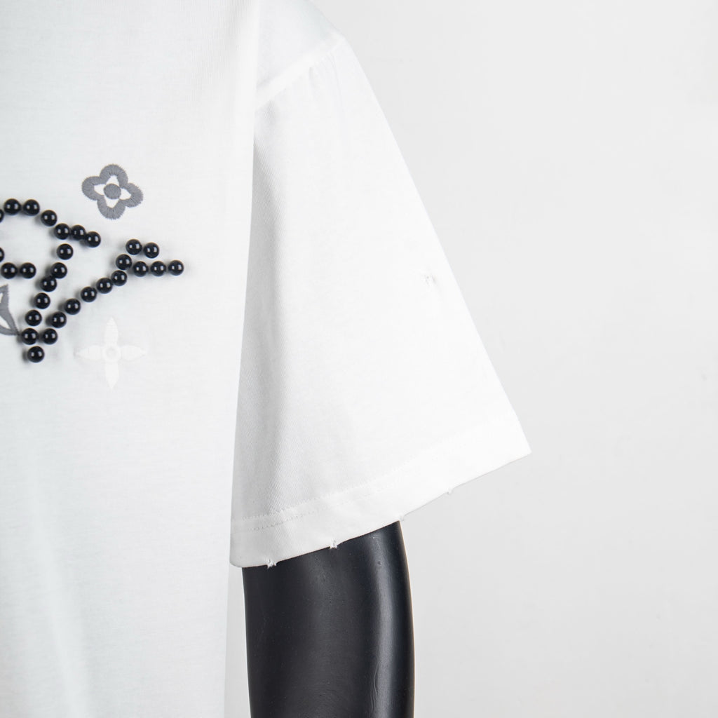 Louis Vuitton T-shirt side view, white fabric with visible seam and hem