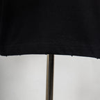 Black T-shirt hem with stitched edge detail
