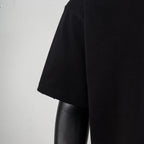 Black crewneck T-shirt side view with short sleeve and straight hem