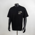 Black crewneck T-shirt with pearl star and flower graphic at chest