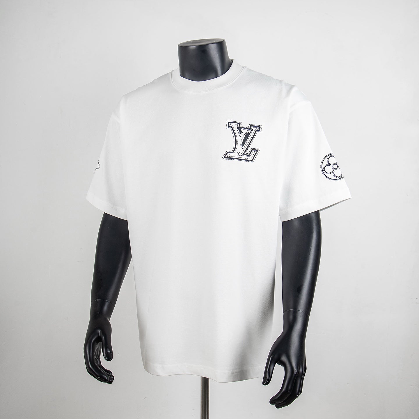 Louis Vuitton white crewneck short-sleeve shirt with LV logo and small sleeve graphic