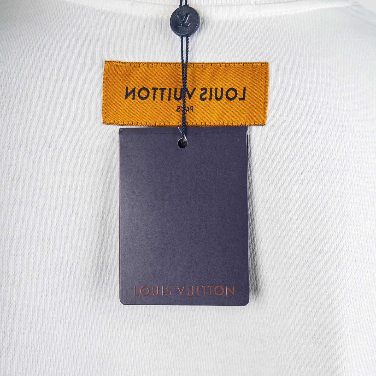 Louis Vuitton short-sleeve shirt with yellow brand tag and Louis Vuitton hang tag