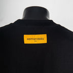 Louis Vuitton black T-shirt with orange brand label at the back neck