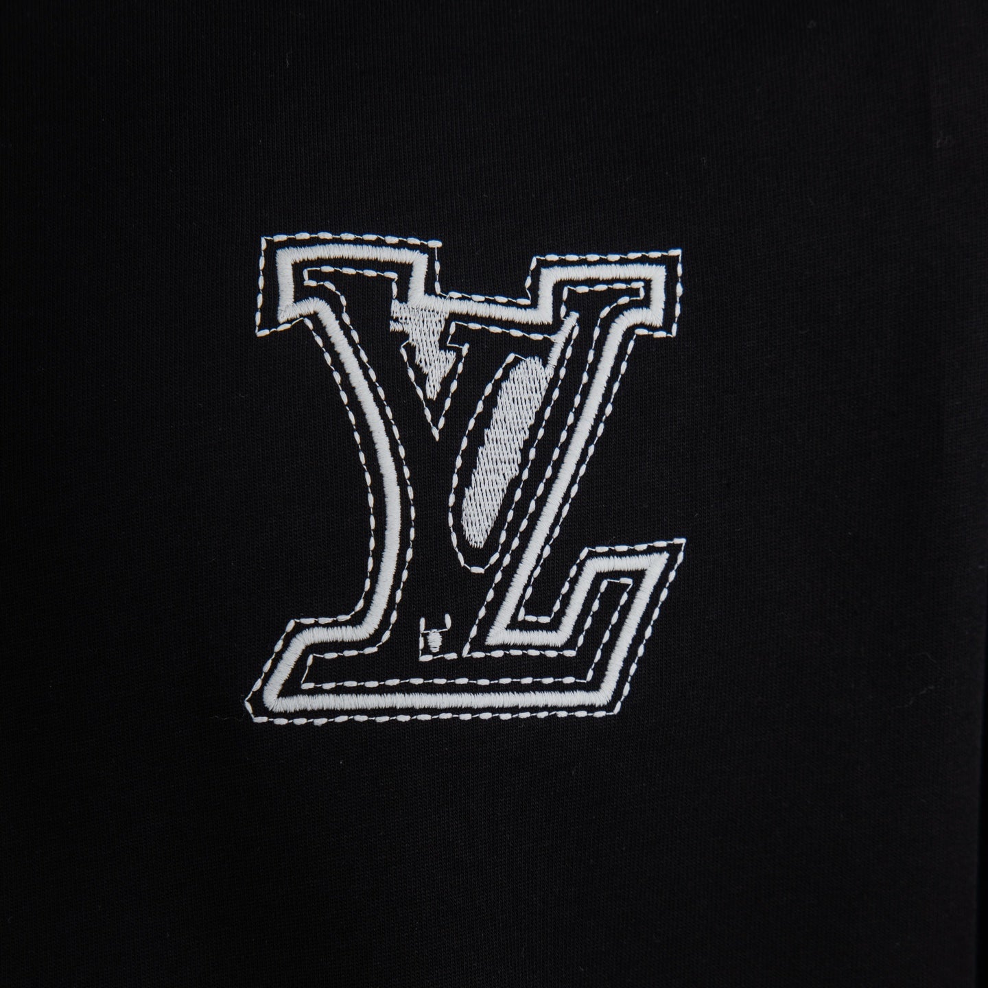 Black T-shirt with large white Louis Vuitton LV monogram embroidery on chest