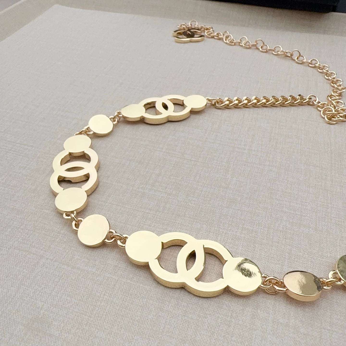 Chanel chain belt with gold circular links and CC cutout centerpiece