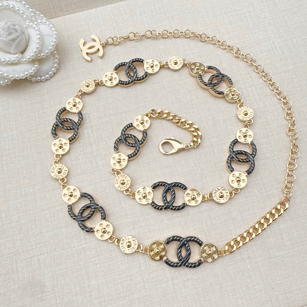 Chanel chain belt on display, gold and dark blue enamel links with CC connector